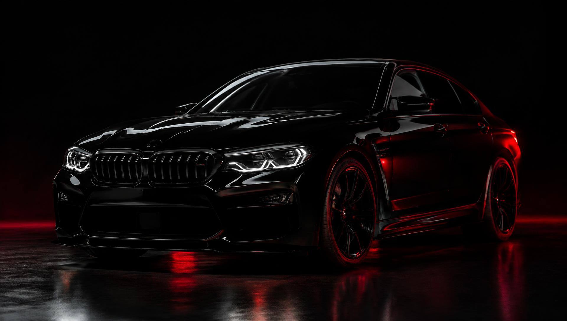 Glossy black sedan with red rim lighting in a dark studio